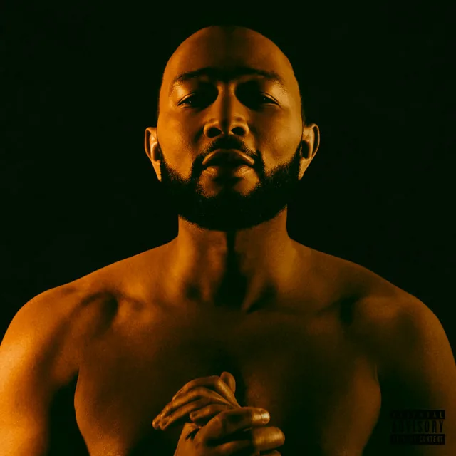 Legend cover: a bare-shouldered portrait lit in amber