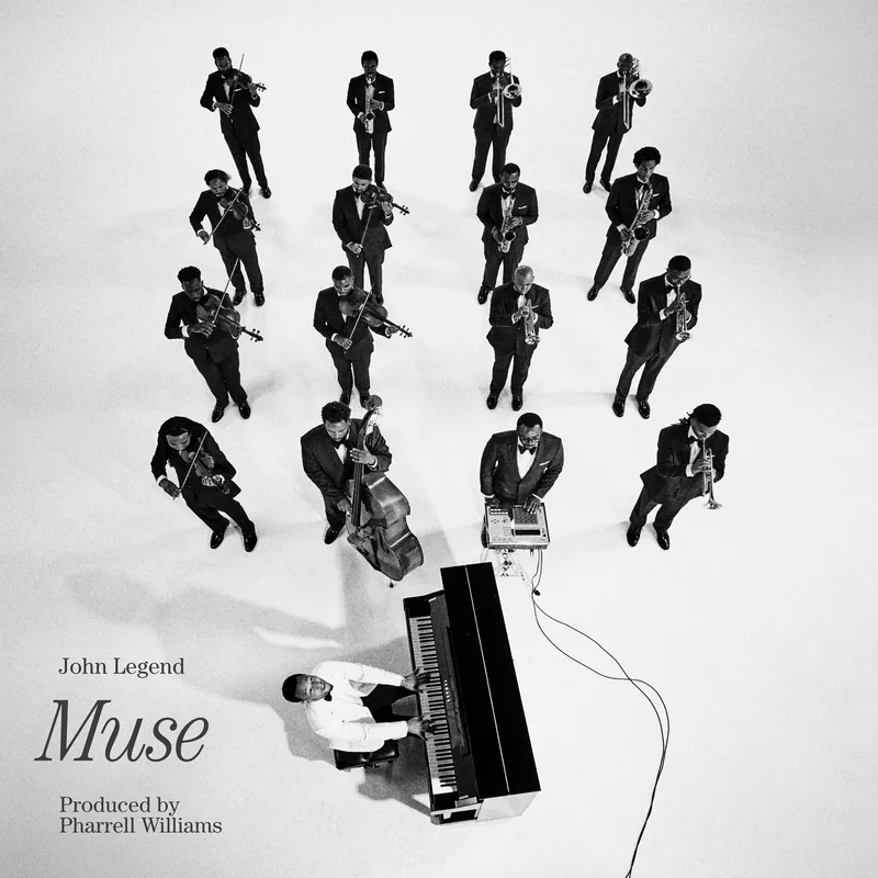 Muse digital cover: the band in dinner jackets seen from above, John Legend in white at the piano