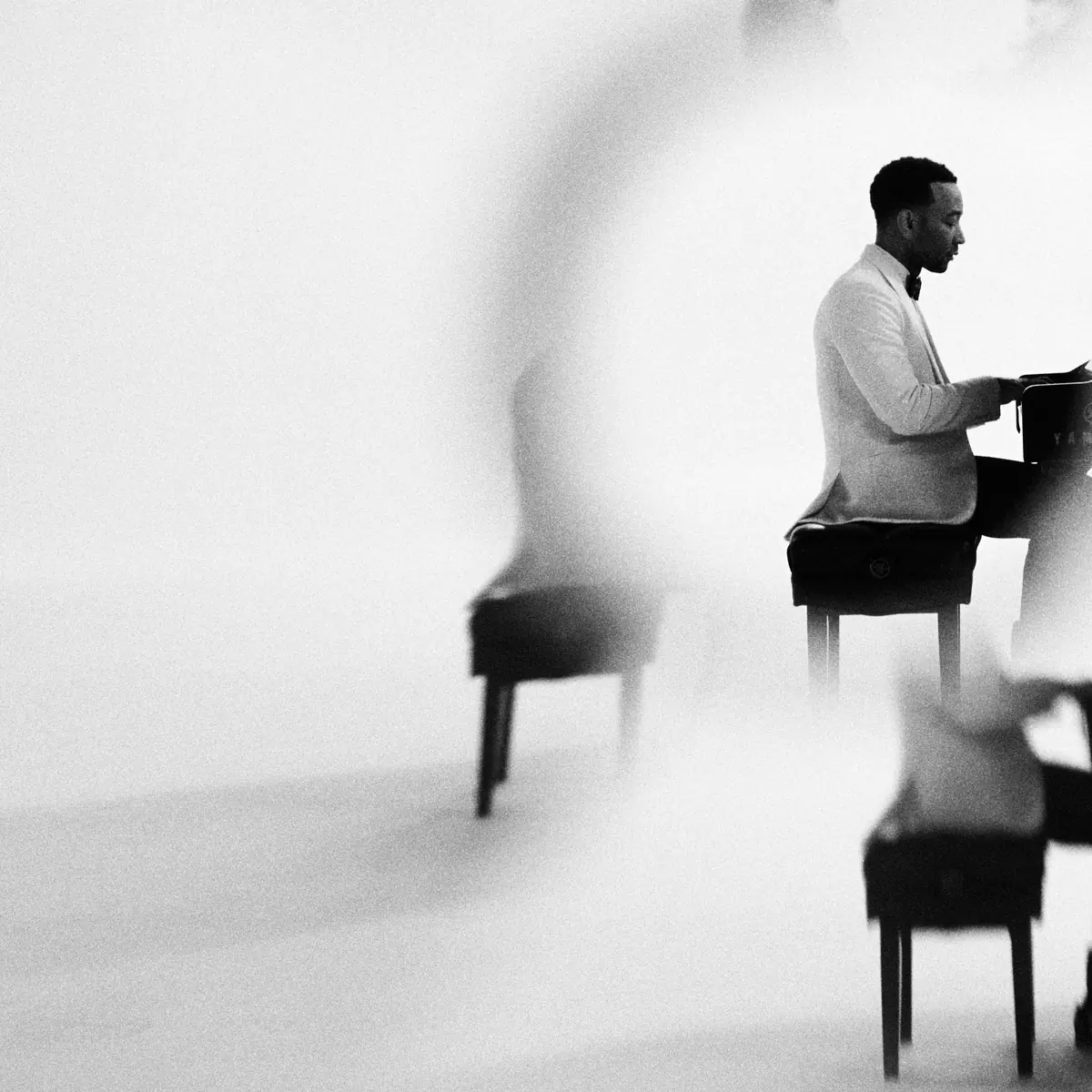 Inner spread, left: a ghosted double exposure of the piano scene in a white studio